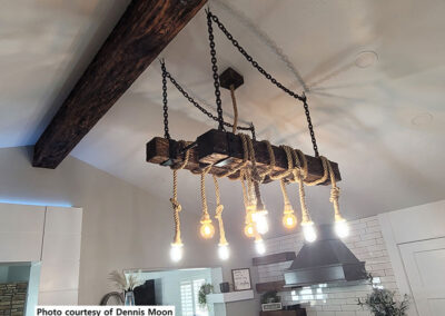 Wood beam and custom chandelier
